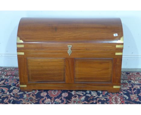 A brass inlaid hardwood dome top trunk with an internal tray 91cm wide x 63cm tall x 50cm deep