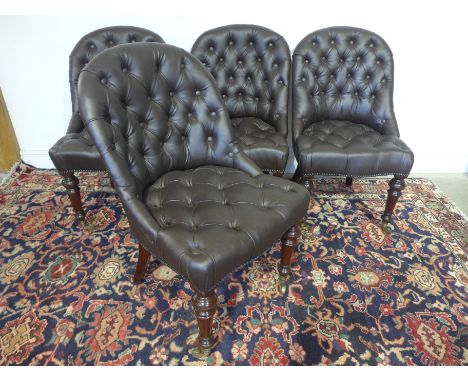 Howard and Sons - A set of four mahogany Library chairs with button leather upholstered seats, two of the chairs are stamped 