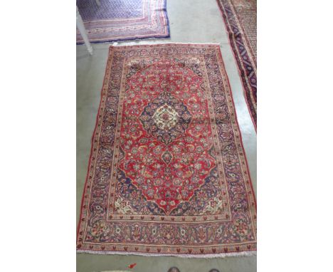 A handmade Royal Kashan carpet with central medallion on red floral field - 235 cm x 143 cm 