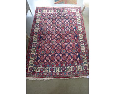 A handmade Tabriz carpet with floral design on blue field - 206 cm x 150 cm 