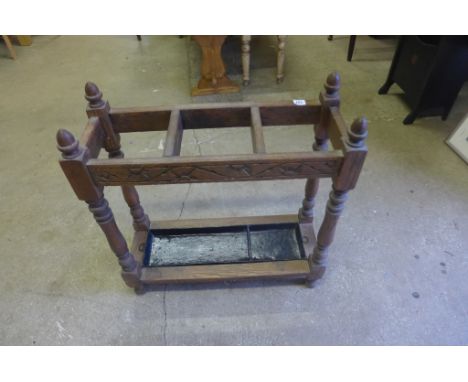 A Victorian tri sectional stick stand with integral drip tray - Width 67 cm