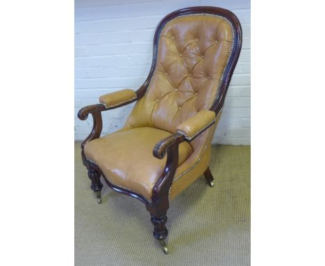 A good quality 19th century mahogany armchair re upholstered in tan button back leather with scroll arms and reeded legs with