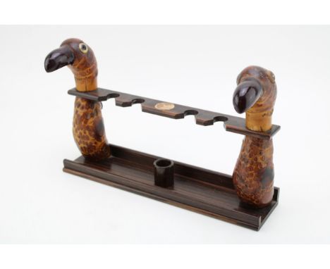 An Art Deco pipe rack in the form of a nut bird, stamped 'Real Ebony, Made in England', similar to those made for Dunhill, 28