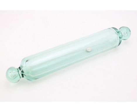 An Edwardian clear glass rolling pin with a silver threepenny piece inside, dated 1903, 38cm long.  Good condition.