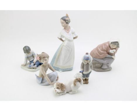 A collection of Nao figurines to include a mermaid, a Geisha and two others with Lladro eskimo and polar bear (5).  In good c
