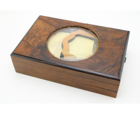 An Edwardian mahogany cased postcard viewer with a collection of early 20th century postcards to include Tintern Abbey, a G H