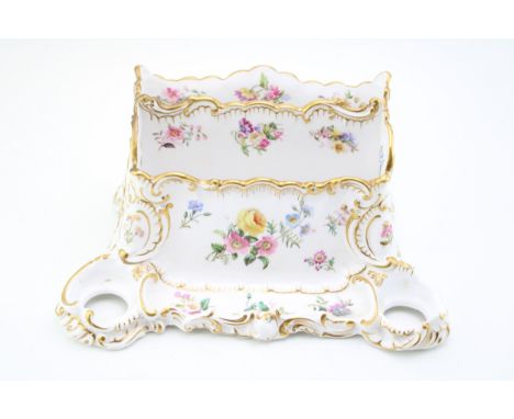 Copeland porcelain two-division desk tidy with two inkwell openings and pen trough, decorated with floral sprays, 29cm wide. 