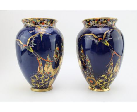 A pair of Carlton Ware Fantasia vases with exotic birds, 20cm tall (2).  In good condition with no obvious damage or restorat