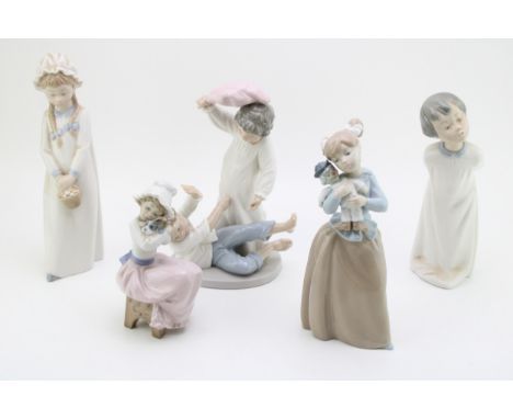 A collection of Nao figurines to include a girl with clown doll,  a girl with a dog and others (5).  In good condition with n
