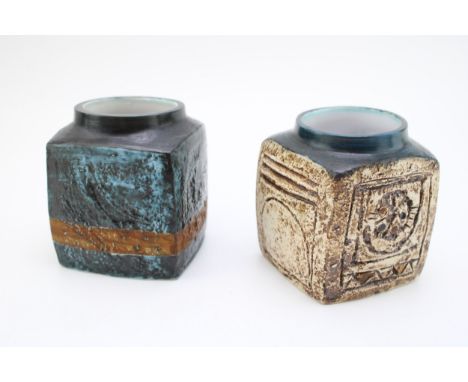 Two Troika square vases, one with blue decoration and the other sandy coloured (2 - the latter with damage), 8cm wide.  Blue 