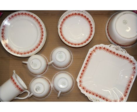 Shelley teaware 11206 in orange geometric design c1915, comprising four trios, cream, bowl and plate, (Qty).  Of first qualit