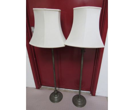 A pair of decorative brass read lamp standards with shades 127cm tall