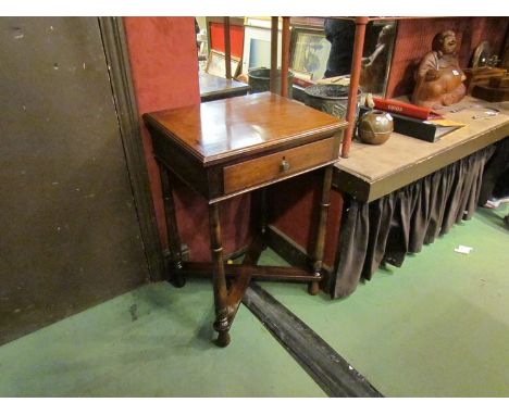 A 19th Century flame mahogany lamp table the single frieze drawer over turned and tapering legs joined by an "X" frame stretc