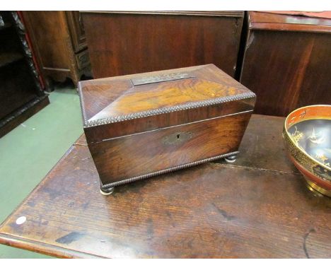 A William IV brass inlaid rosewood sarcophagus tea caddy with later silver rimmed glass mixing bowl 