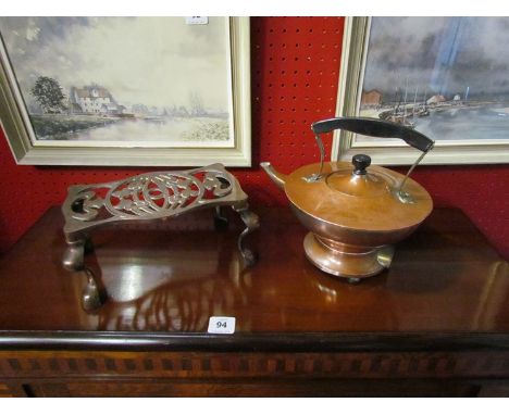 An Aladins lamp form copper electric kettle together with an Art Nouveau design trivet (2)