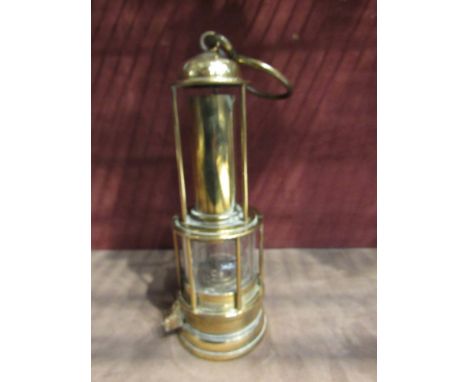 Unusual miners lamp, stamped 'Laidler, Durham' all brass underfeed with narrow gauze/brass bonnet opening below a domed top g