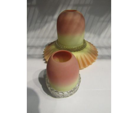 A Burmese glass night light, pink to cream tint, moulded clear glass base, together with a frilled example (2) 