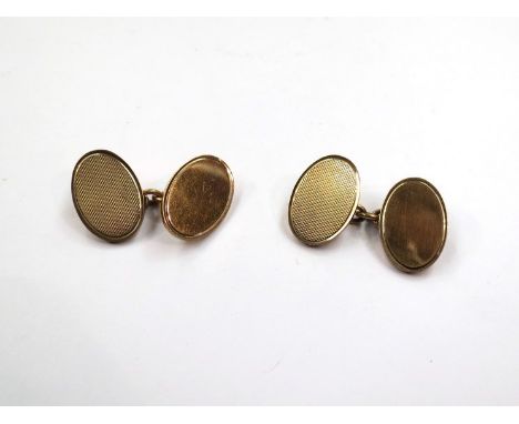 A pair of 9ct gold cufflinks, engine turned detail,  10.9g 