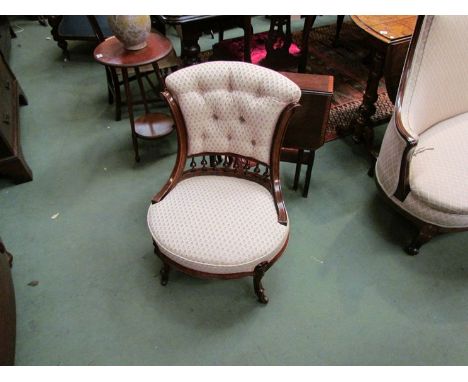 Circa 1860 walnut bedroom chair the buttoned scroll back  on turned spindles over a bow front seat on carved scroll foot legs