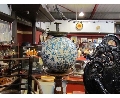 A porcelain ball with blue, floral swag detail, prevents rats, mice climbing up to eat the candle wax, with a brass chamber s