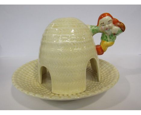 A Clarice Cliff Wilkinson Ltd gnome ware night light, domed with applied gnome handle to a dish base 