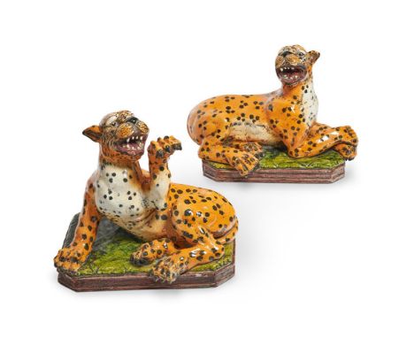 A PAIR OF ITALIAN GLAZED POTTERY MODELS OF LEOPARDS 20TH CENTURY Naturalistically painted in coloured glazes, boldly modelled