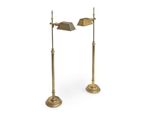 † A PAIR OF CONTEMPORARY BRASS STANDARD LAMPSBY GUINEVERE with Bakelite finial, and pierced lamp shade, UK wire  128cm high o