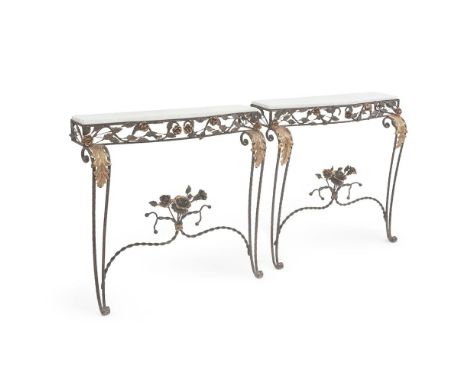 A PAIR OF FRENCH WROUGHT IRON CONSOLE TABLESMID 20TH CENTURYWith white marble tops above the scrolled supports92cm high, 91cm
