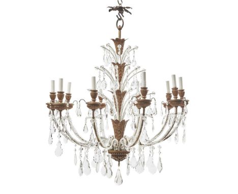 AN ITALIAN BEADED GLASS AND GILTWOOD TEN LIGHT CHANDELIER  CIRCA 1930 With gilt Tole leaves to the stem 97cm high, 84cm diame