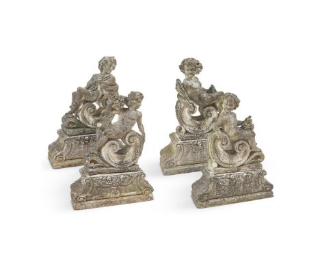 A SET OF FOUR LARGE COMPOSITION STONE GARDEN FIGURES OF PUTTI FIRST HALF 20TH CENTURY, CONTINENTAL Emblematic of the Four Sea