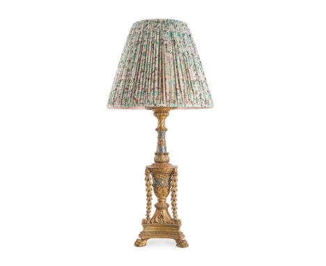 AN ITALIAN CARVED GILTWOOD & PAINTED TRIFORM LAMP MID 19TH CENTURY Carved with garlands and fruiting vines on paw feet, UK wi