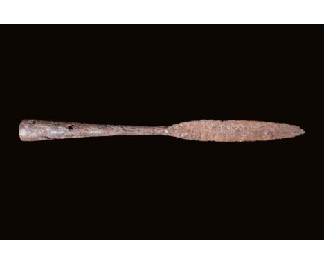Ca. AD 1 - 300.An iron spearhead featuring a leaf-shaped pointed blade. The socket gently flares toward its opening.Size: 290