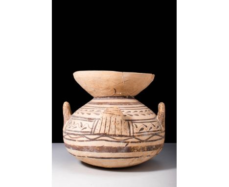 Ca. 500 - 400 BC.A pottery krater with two handles modelled to resemble upraised hands, and two tab-shaped handles. The krate