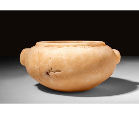 Early Dynastic Period, Ca. 3100 - 2800 BCAn Egyptian Early Dynastic elegant hand-carved alabaster bowl of a sizable form with