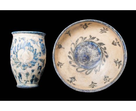 Ca. AD 1300 - 1400.A pair of Mamluk terracotta vessels painted under the glaze. The first vessel, on the left, is a tall, lar