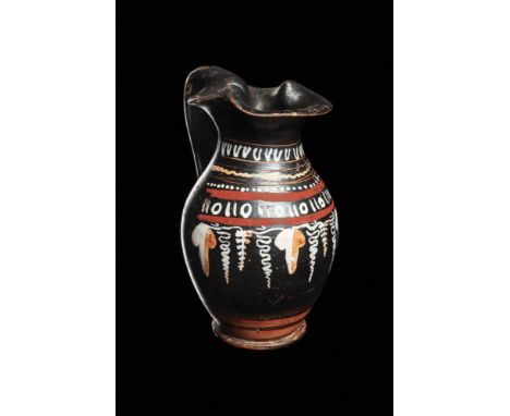 Magna Graecia, Ca. 350 BCA decorated pottery oinochoe with a trefoil lip and a strap handle. Decorated with white and ocher-p