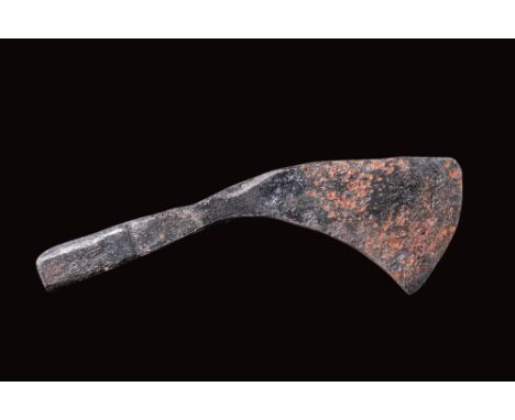 Ca. AD 1100 - 1200.An iron axe head with an asymmetrical blade and a round shaft-hole socket with a hammer end. Crafted prima