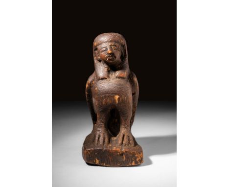 Ptolemaic Period, Ca. 332 - 30 BCAn Egyptian wooden statuette of Ba-Bird carefully depicts a human-headed bird standing on a 