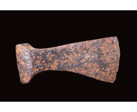Ca. AD 900 - 1100.An iron axe head with a curved blade, a shaft-hole socket and a rounded butt.Size: 140mm x 65mm; weight 550