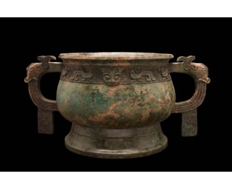 Early Western Zhou Dynasty, Ca. 11th - 10th century BCThe body of the vessel is bulbous in shape, containing a band of elabor