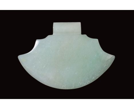Ca. AD 1600.A jade carving in the shape of a flat-section axe head. The upper section features a rectangular tang designed fo