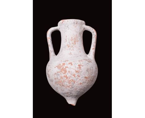 Ca. AD 100 - 200.A wheel-thrown pottery amphora with a slender, pointed base, a globular body, a gently tapered neck, and a t