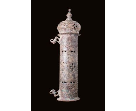 Ca. AD 1400 - 1500.A cast bronze incense burner/lantern of a tubular, hollow form with openwork walls, allowing the scent to 