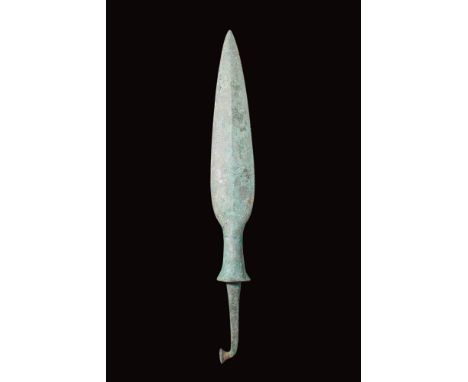 Ca. 1st millennium BC.A nicely formed bronze spearhead features a leaf-shaped blade with an accentuated midrib that extends t