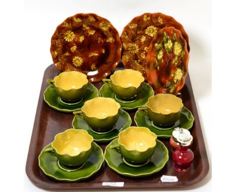 A small collection of Linthorpe pottery including six teacups and saucers, three plates, a mustard and a pepperrette 