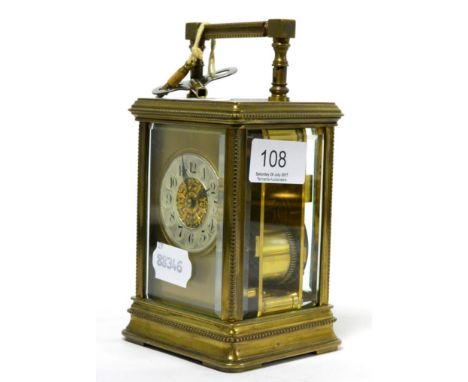 A brass striking carriage clock, twin barrelled movement striking on a gong, circa 1900