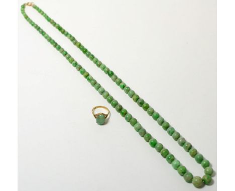 A jade necklace and a 9ct gold jade ring (2)Jade necklace - 61g gross. Jade ring - finger size N, 3.14g gross. 