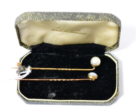 An opal stick pin and a pearl stick pin, unmarked yellow metalOpal stick pin - 1.35g gross. Pearl stick pin - 2.34g gross. 