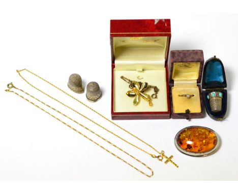 A group of jewellery including a pearl set ring, cross pendant, amber brooch, Continental silver thimble in original case etc