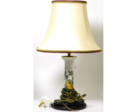 A Moorcroft Blackberry pattern pottery table lamp Appears in good condition. 